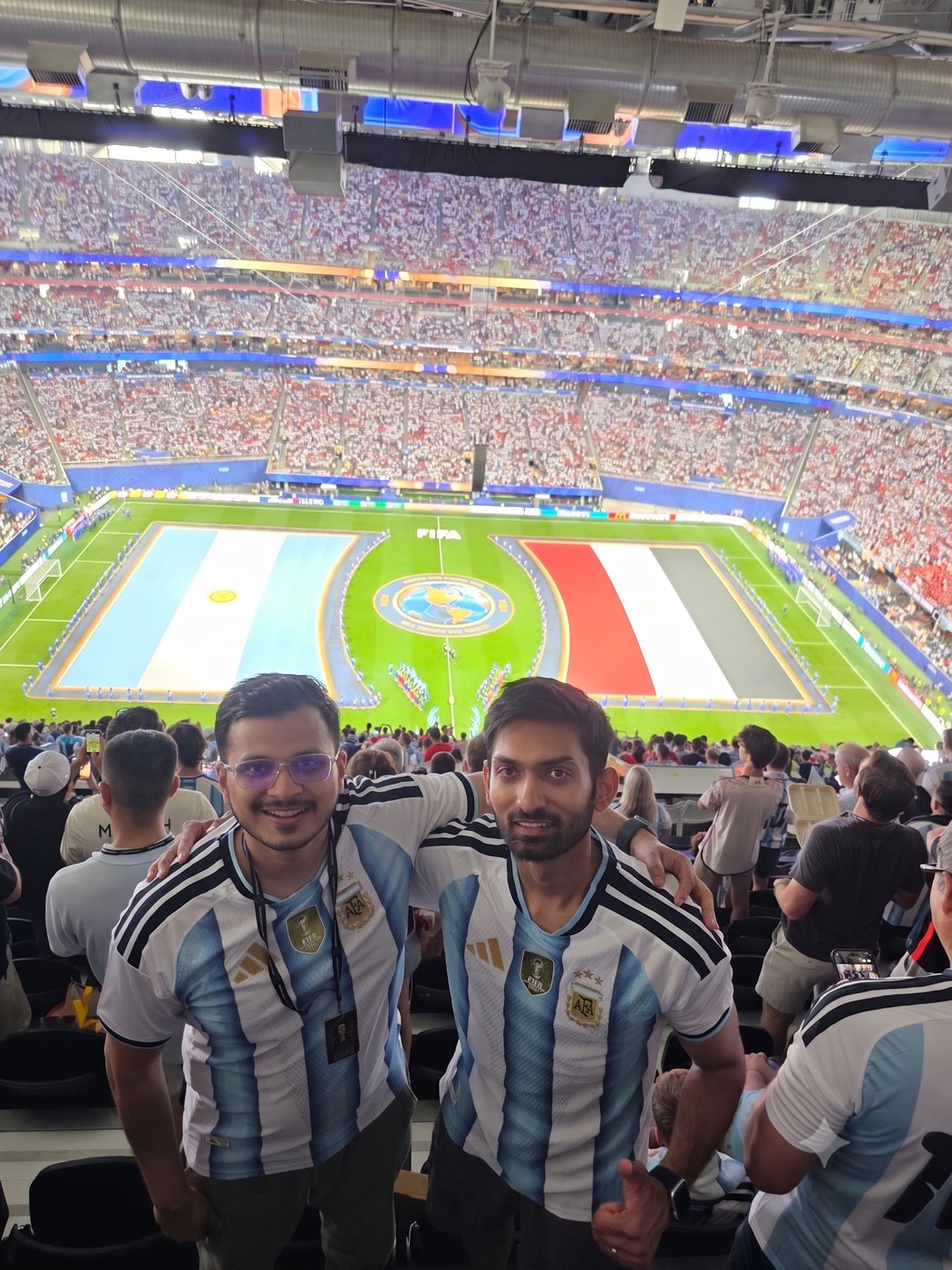 With a friend in the stands for Argentina against Egypt, the pitch below dressed in both flags